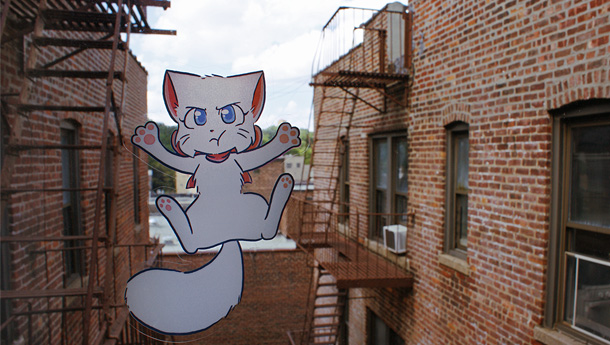 Two photos, of the Lucy and Paulo stickers respectively